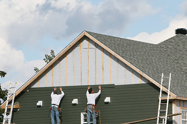 Professional Siding technician working in Aydlett, NC